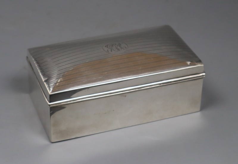 A George V silver mounted rectangular cigarette box, A & J Zimmerman, Birmingham, 1920, 16.3cm, gross 20 oz.